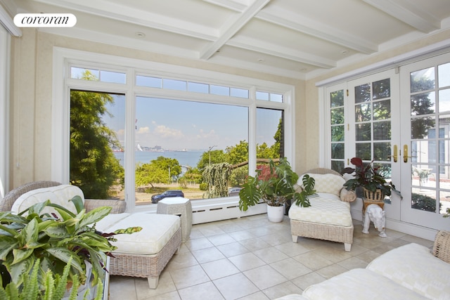 sunroom / solarium with beam ceiling, french doors, and a water view