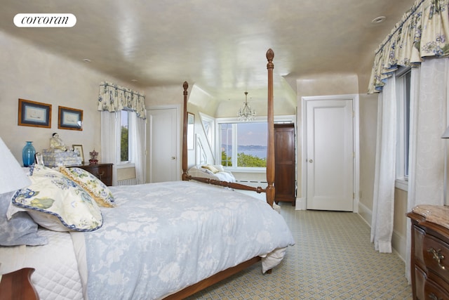 bedroom featuring an inviting chandelier