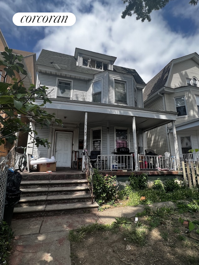 400 E 8th St, New York City, NY 11218 - view of front of house featuring covered porch