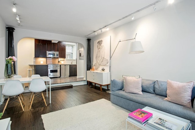 living room with dark hardwood / wood-style flooring