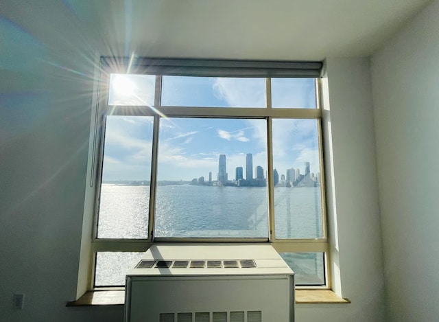 empty room with a water view and a view of skyline