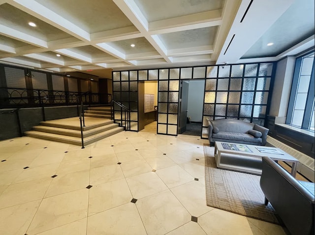 building lobby with coffered ceiling, beam ceiling, and recessed lighting