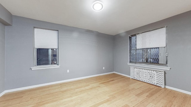 unfurnished living room featuring hardwood / wood-style floors