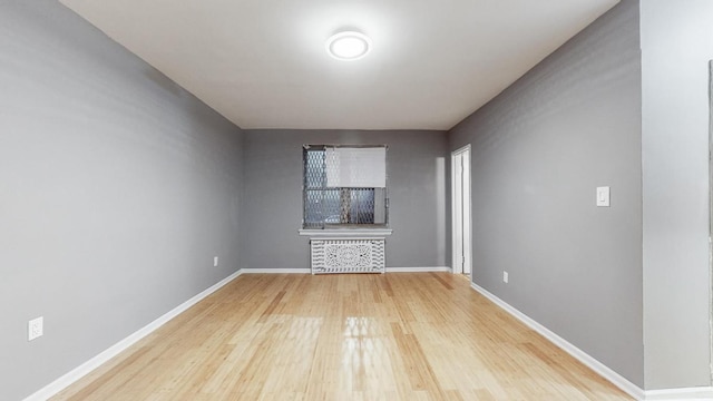 unfurnished living room with hardwood / wood-style floors