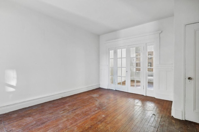 spare room with dark wood-type flooring