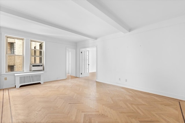 empty room featuring light parquet floors, cooling unit, radiator, and beamed ceiling