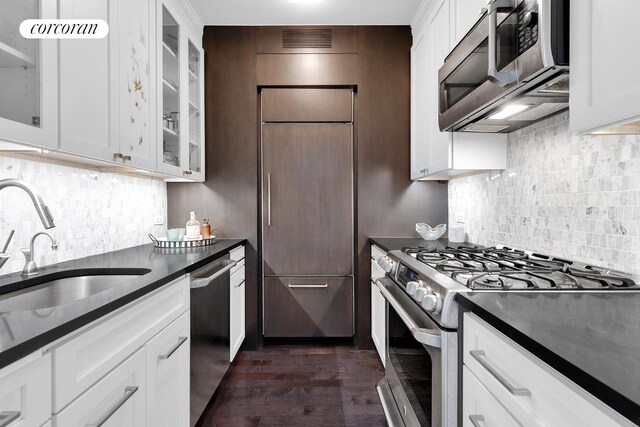 kitchen featuring stainless steel appliances and white cabinets