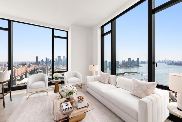 living room with floor to ceiling windows and a water view