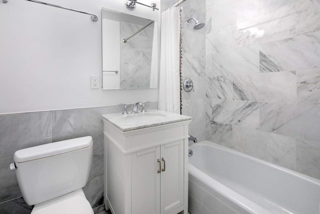 full bathroom with shower / bath combination with curtain, vanity, toilet, and tile walls