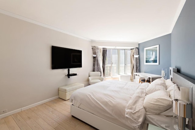 bedroom with crown molding and light hardwood / wood-style flooring