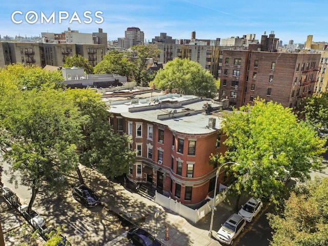 birds eye view of property featuring a view of city