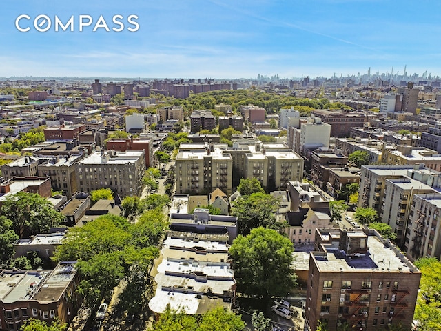 birds eye view of property with a city view