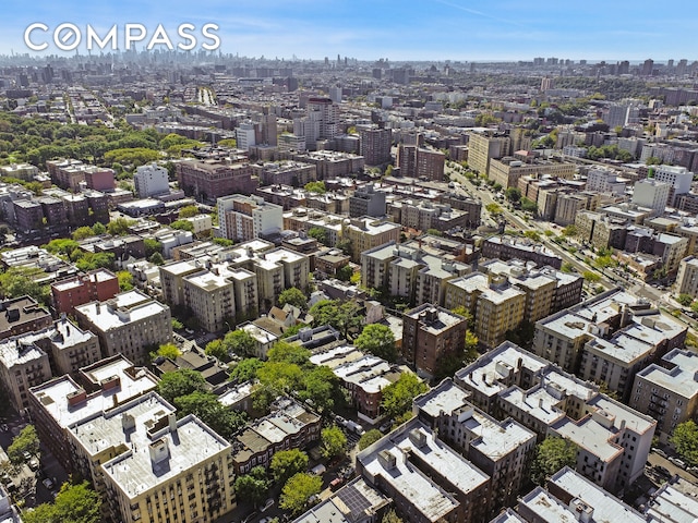 birds eye view of property featuring a city view