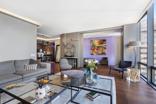 living room with expansive windows and hardwood / wood-style floors