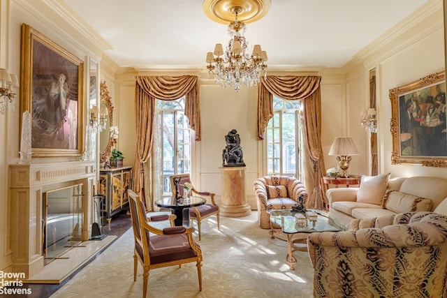 living area featuring a fireplace, ornamental molding, and a chandelier