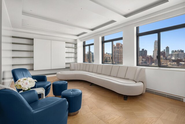 interior space with a tray ceiling and built in features