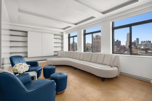 sunroom / solarium with a view of city, plenty of natural light, a raised ceiling, and visible vents