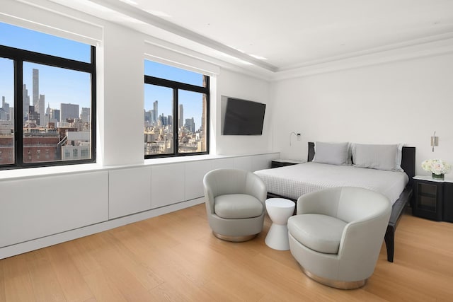 bedroom featuring light wood-type flooring and multiple windows