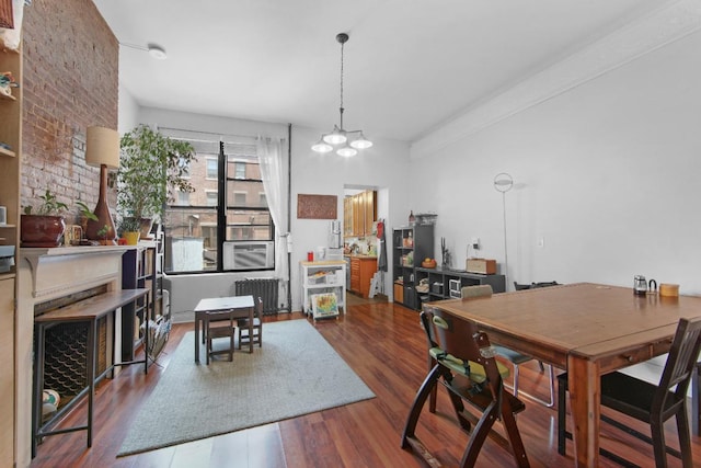 dining area with an inviting chandelier and hardwood / wood-style floors