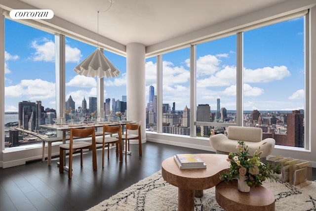 sunroom featuring a city view and visible vents