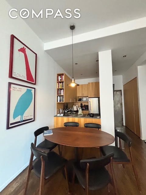 dining area featuring dark hardwood / wood-style floors