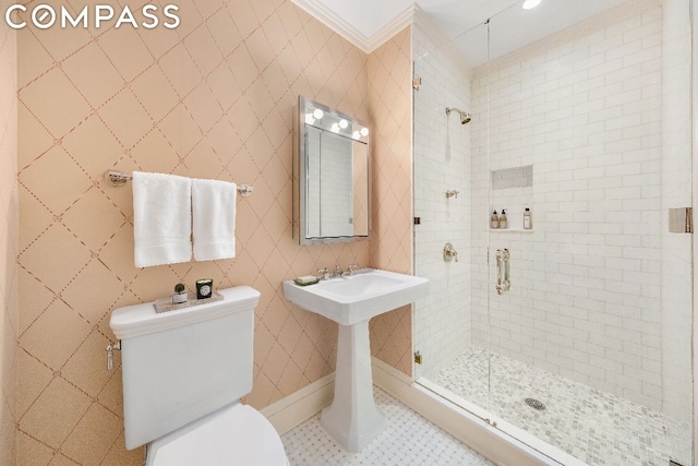 bathroom featuring sink, tile patterned flooring, toilet, a shower with door, and crown molding