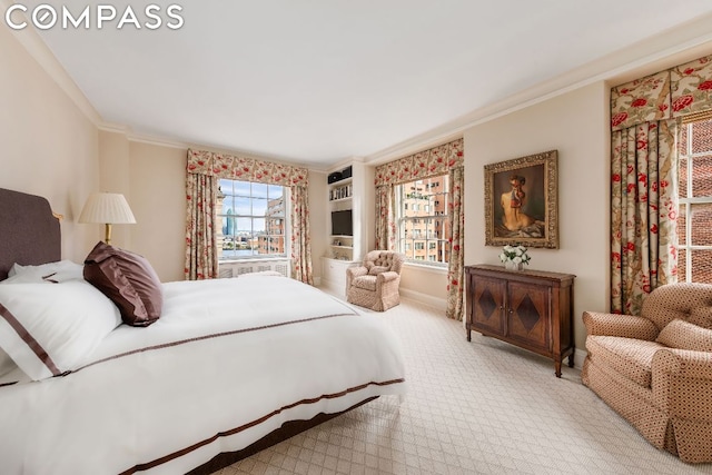 bedroom with light carpet and crown molding