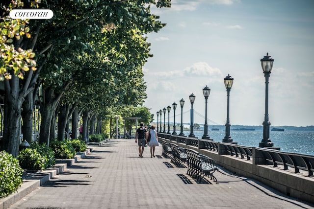 surrounding community featuring a water view