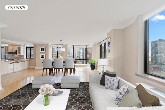 living room with light hardwood / wood-style flooring, ornamental molding, and floor to ceiling windows