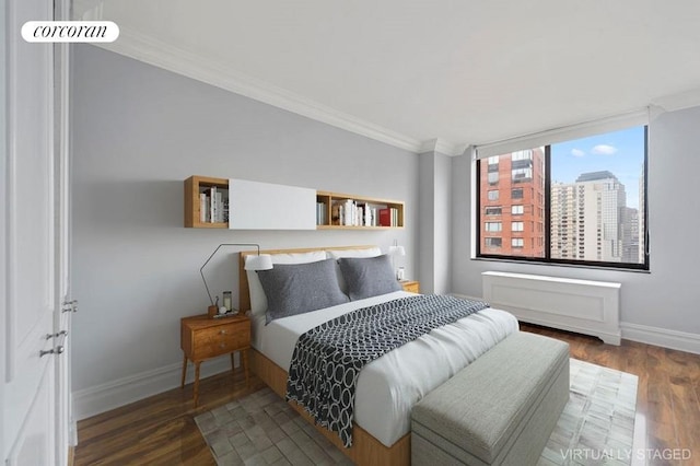 bedroom with dark hardwood / wood-style flooring