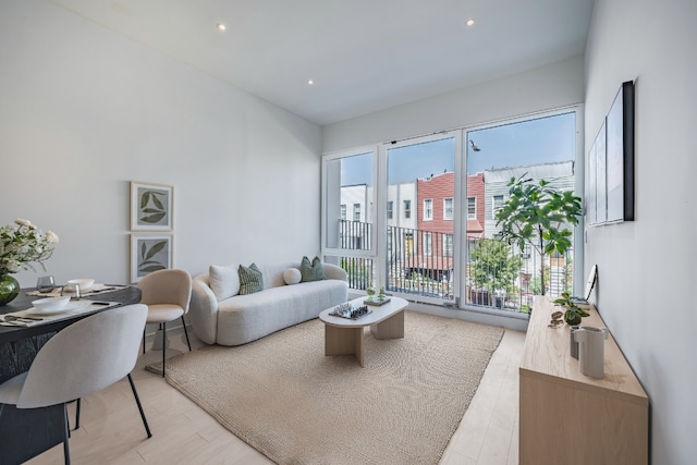 living room with light hardwood / wood-style flooring