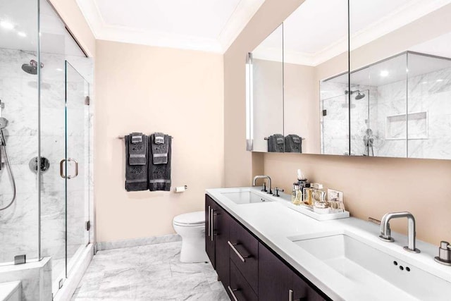 bathroom with ornamental molding, walk in shower, vanity, and toilet