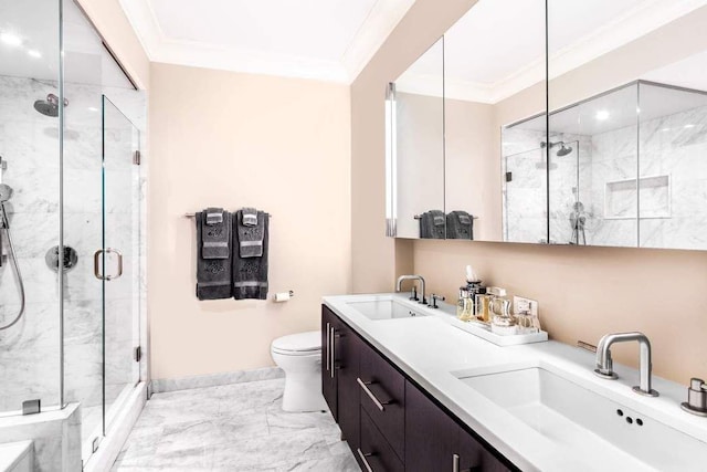 full bath with a shower stall, marble finish floor, crown molding, and a sink