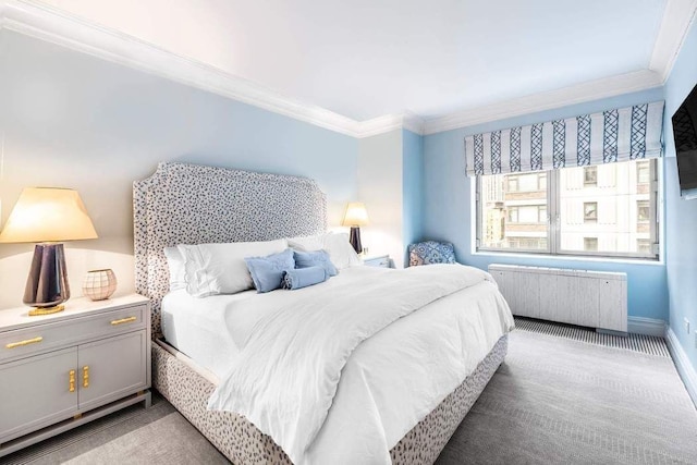bedroom featuring radiator heating unit, carpet floors, baseboards, and ornamental molding