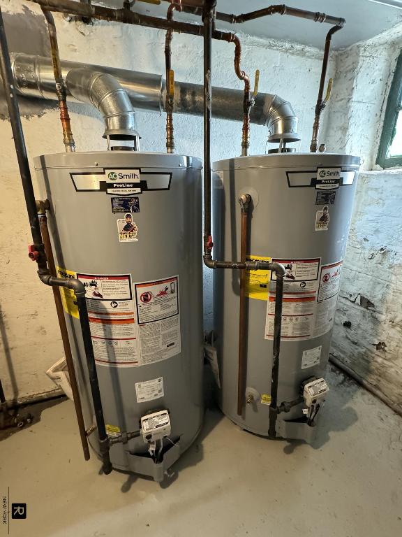 utility room featuring gas water heater