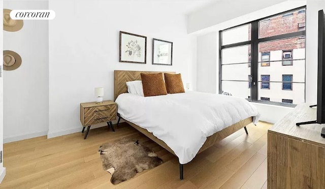 bedroom with light hardwood / wood-style floors