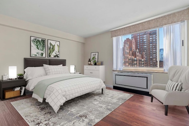 bedroom featuring dark wood-type flooring