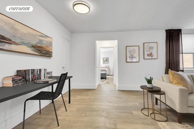 office space with light hardwood / wood-style floors