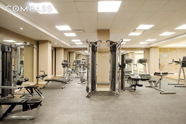 gym featuring a drop ceiling