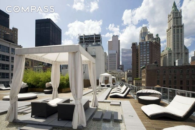 view of patio / terrace featuring a city view and a gazebo