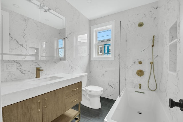 full bathroom featuring vanity, shower / bathing tub combination, tile walls, and toilet