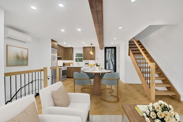 dining room with sink, a wall unit AC, and light parquet floors