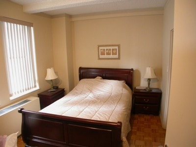 bedroom with beam ceiling