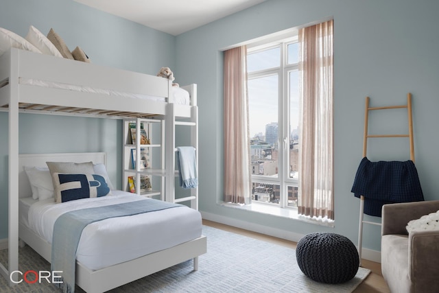 555 W 22nd St Unit Ph16Be, New York City, NY 10011 - bedroom with baseboards and wood finished floors