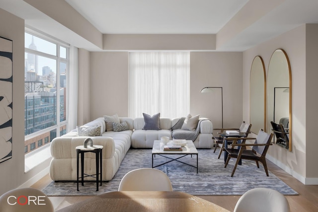 555 W 22nd St Unit Ph16Be, New York City, NY 10011 - living area with wood finished floors, baseboards, and a city view