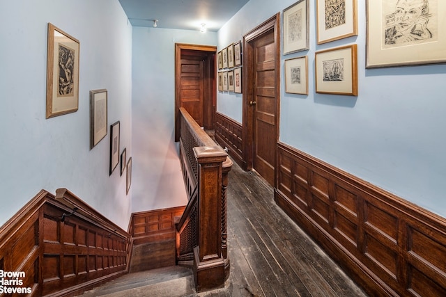 hall with dark hardwood / wood-style flooring