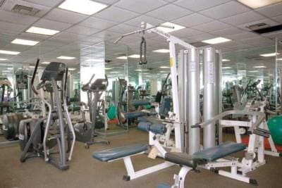 gym featuring a drop ceiling