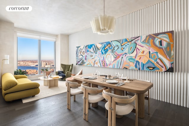 dining room with visible vents and wood finished floors