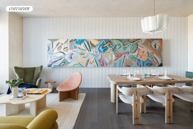 dining room featuring visible vents, wallpapered walls, and dark wood-type flooring