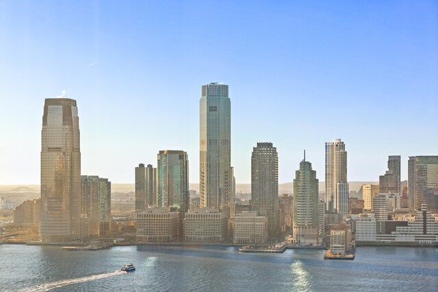 property's view of city with a water view